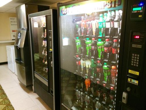 a vending machine filled with lots of soda bottles at Super 8 by Wyndham Idaho Falls in Idaho Falls