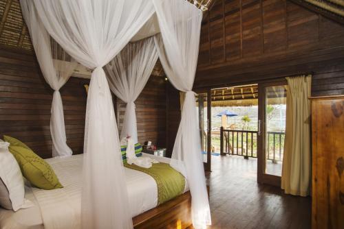 Voodi või voodid majutusasutuse Laguna Reef Huts toas
