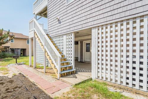 a house with a staircase leading to a door at Ocean View's in Kill Devil Hills