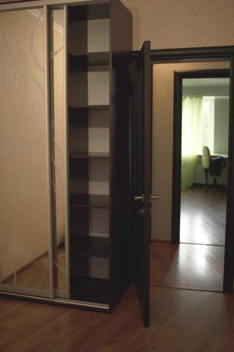 a room with a glass door and a mirror at Seven Apart Hotel in Vyshneve