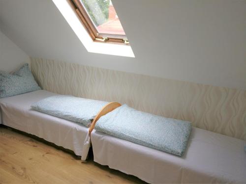Postel nebo postele na pokoji v ubytování Marica Apartman