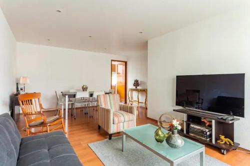 a living room with a couch and a table at At the heart of restaurants and night life in Mexico City