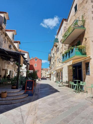 an empty street in an old town with buildings at The best location in Makarska,free P, option bikes in Makarska