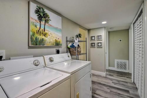 a laundry room with a washer and dryer at Cozy Sarasota Retreat - 3 Blocks to the Coast! in Sarasota