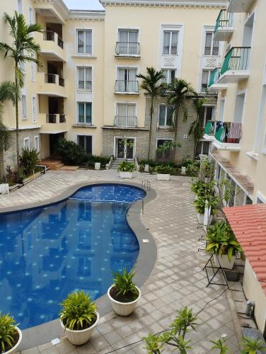 an image of a swimming pool in an apartment building at Royal Pool View Apartment by Leela Homes in Old Goa