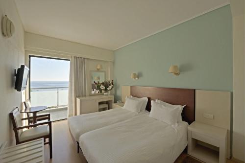 Postel nebo postele na pokoji v ubytování Esperia Hotel