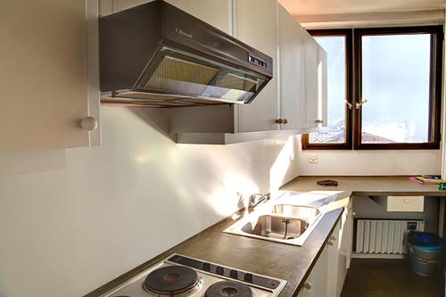 a kitchen with a sink and a stove top oven at Apartment in Chamonix in Chamonix-Mont-Blanc