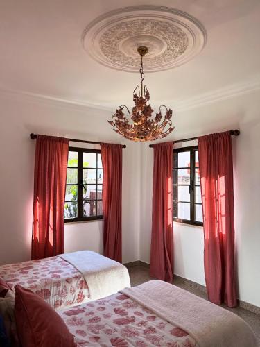 Ένα ή περισσότερα κρεβάτια σε δωμάτιο στο Sunshine Villa