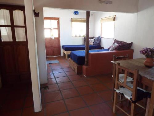 a living room with a couch and a table at El Sueñero in Tilcara