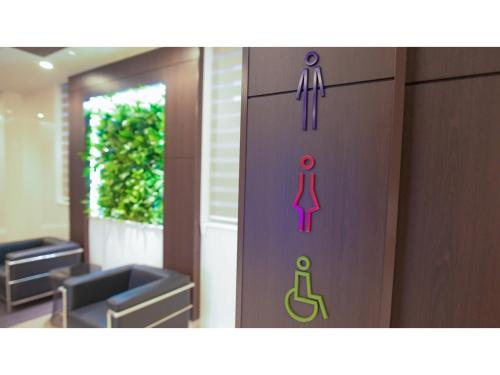 a door with three different signs on it at ＹＯＵ ＳＴＹＬＥ ＨＯＴＥＬ ＨＡＫＡＴＡ - Vacation STAY 16033v in Fukuoka