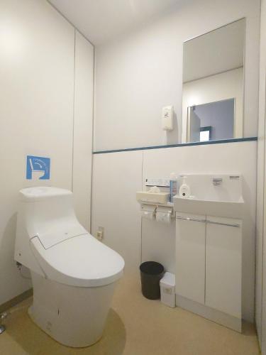 a bathroom with a white toilet and a sink at Cate no mori - Vacation STAY 20997v in Shime