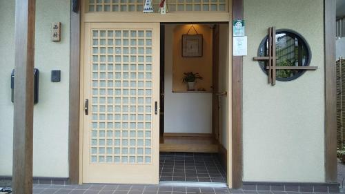 a front door of a house with a doorframe at Guest House Nishimura - Vacation STAY 13436 in Kyoto