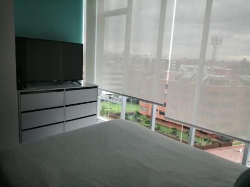 Ein Bett oder Betten in einem Zimmer der Unterkunft Loft Moderno en Bogotá -Usaquén