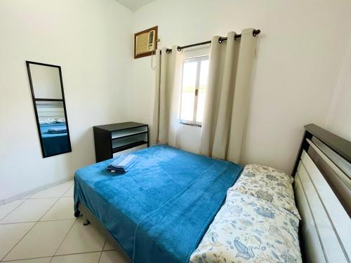 En eller flere senger på et rom på Apartamento aconchegante com ar condicionado - Frade, Angra dos Reis