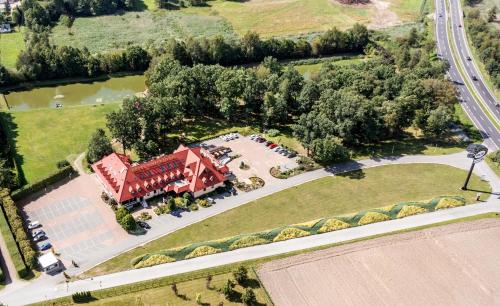an overhead view of a large house with a building at Hotel Styl 70 in Pszczyna