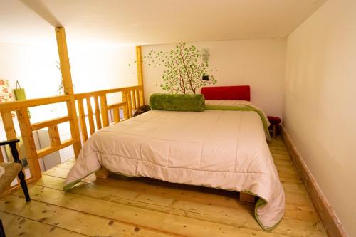 a bedroom with a bed in the corner of a room at Casa Rosi - Loft tra i monti di Roccaraso in Rionero Sannitico