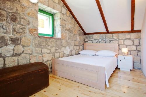 Un pat sau paturi într-o cameră la Villa Gordana