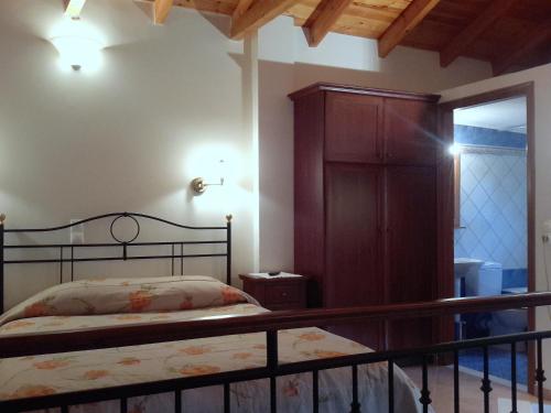 מיטה או מיטות בחדר ב-En Feneo