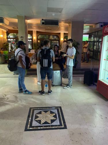 a group of people standing around in a building at Shady Hotel Luxor in Luxor