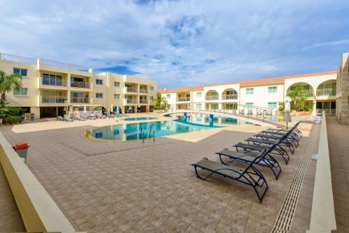 a courtyard with a swimming pool in a building at Great Kings Resorts in Protaras