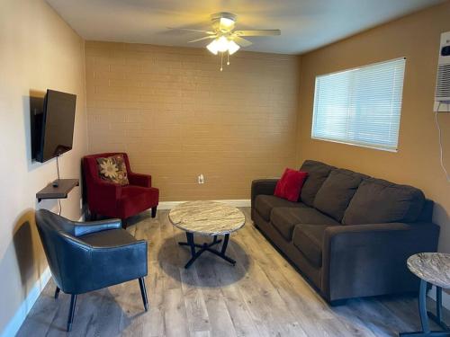 a living room with a couch and a table at #2 bedroom cozy SUITE, 1 min walk to the beach # in Bullhead City