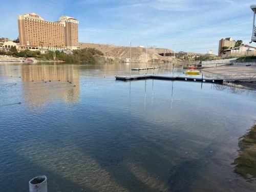 a body of water with a dock in a city at #2 bedroom cozy SUITE, 1 min walk to the beach # in Bullhead City
