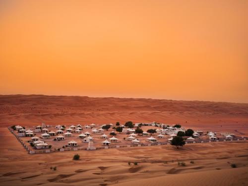 an aerial view of a compound in the desert at Desert Nights Resort in Shāhiq