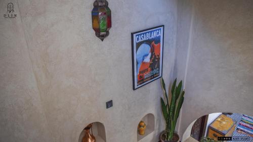 a wall with a poster of a movie on it at Auberge RIAD DLIM Tamraght in Tamraght Ouzdar
