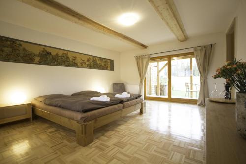 a bedroom with a bed with a painting on the wall at Apartments Wolkentor in Halle an der Saale