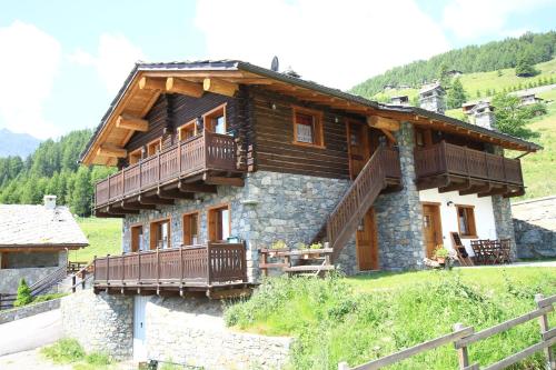 a house with balconies on the side of it at Residence Trompe-L'oeil in Champoluc