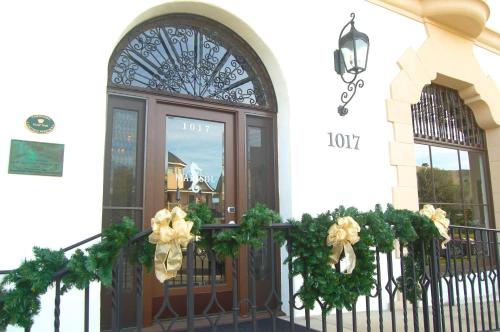a front door of a building with wreaths on it at Hotel Marisol Coronado in San Diego
