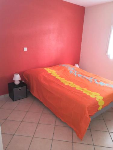 Llit o llits en una habitació de Le Muscadier