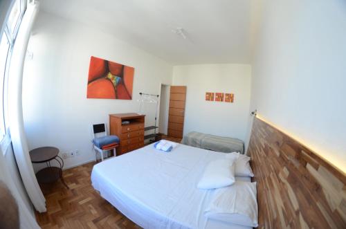 מיטה או מיטות בחדר ב-Copacabana wonderful apartment