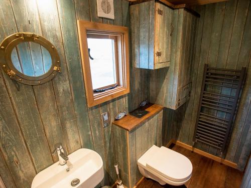 a bathroom with a sink and a toilet at The Shepherds Hut At Gowan Bank Farm in Staveley