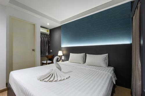 Postel nebo postele na pokoji v ubytování Siam Star Hotel