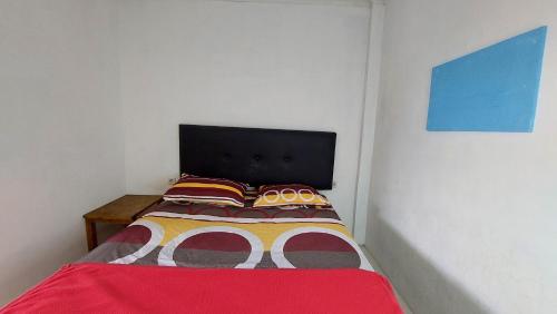 Postel nebo postele na pokoji v ubytování Harry & Mimin Homestay