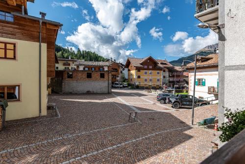 a view of a parking lot in a town at Appartamento Tobià in Pozza di Fassa