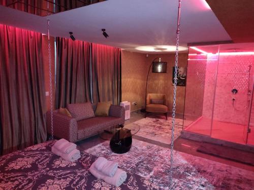 a room with a shower with a couch and a chair at Кокиче 3 in Sofia