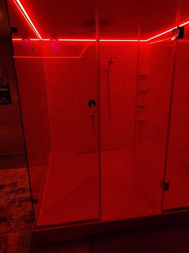 a red locker room with red lights on it at Кокиче 3 in Sofia