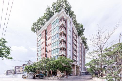 an architectural rendering of a tall building at Latin Garden Hotel in Bangkok