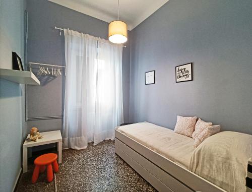 Łóżko lub łóżka w pokoju w obiekcie Redipuglia21Home a fianco ospedale e spiaggia