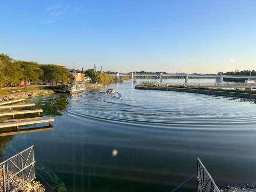 a river with a boat in the water at Nuk's Executive Suites in De Pere