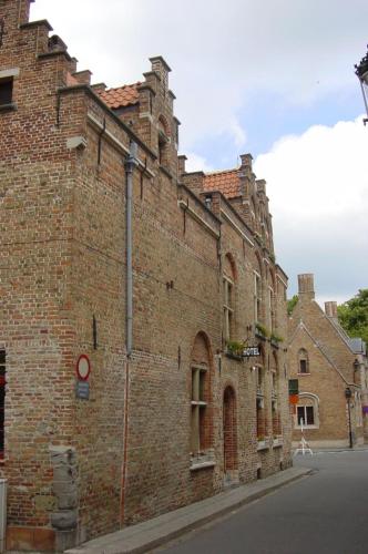 an old brick building on the side of a street at Hotel Salvators in Bruges