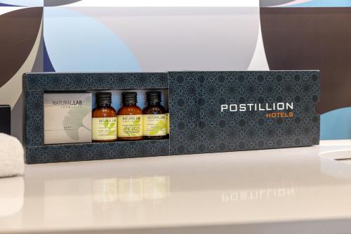 a display of four bottles of potilulin whiskey at Postillion Hotel WTC Rotterdam in Rotterdam