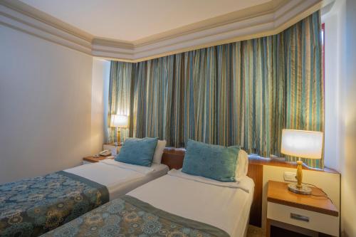 Letto o letti in una camera di Villa Side Hotel