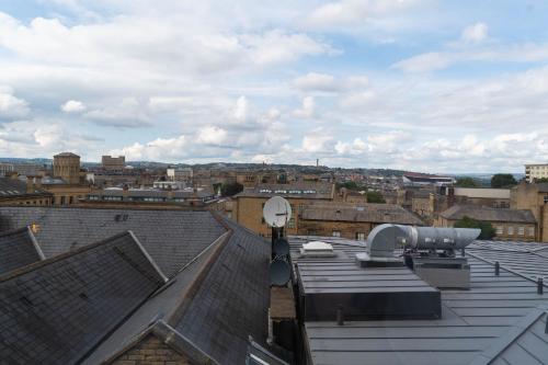 a view of a city from the roof of a building at Sky Apartments in Bradford