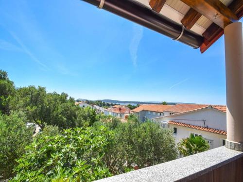 a view from the balcony of a house at Apartments Jaklin in Rab