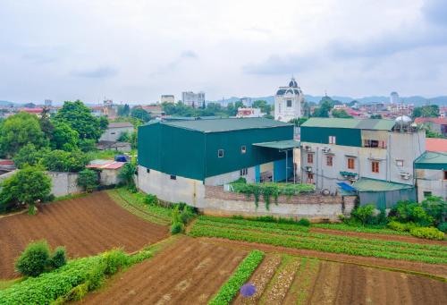 an aerial view of a farm and a field at Nhà Nghỉ Xuân Mai in Lạng Sơn