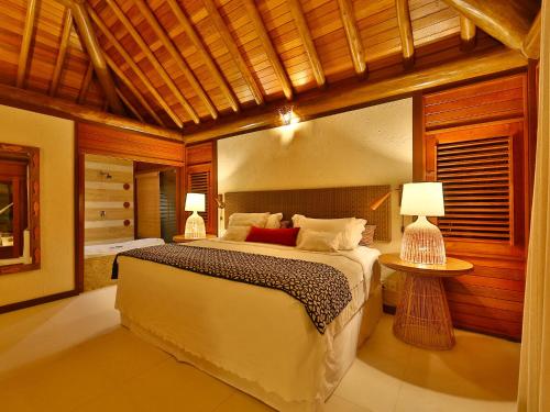 Katil atau katil-katil dalam bilik di Camurim Grande Pousada & SPA - Jantar Incluído