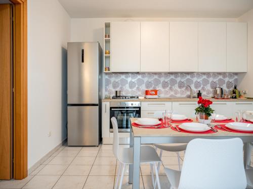 Kuchyň nebo kuchyňský kout v ubytování Ca' Mastro Bright Flat with parking